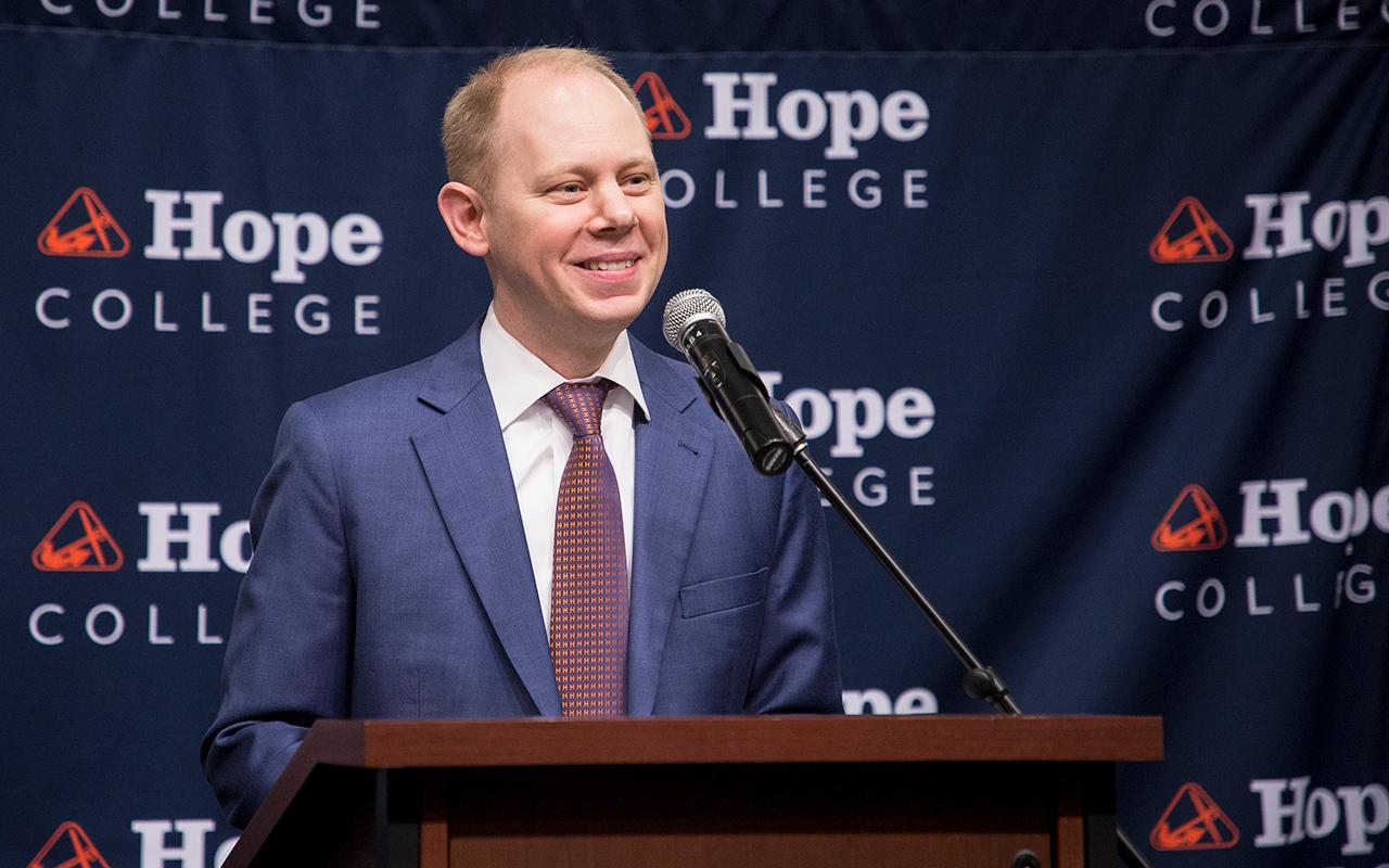 Matt Scogin speaking at a podium