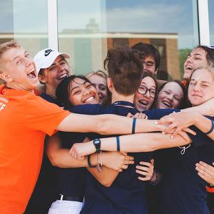 A group of Awakening students hugging