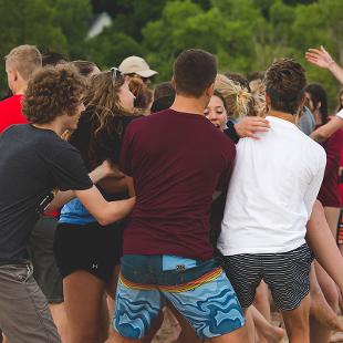 Students playing on the beach