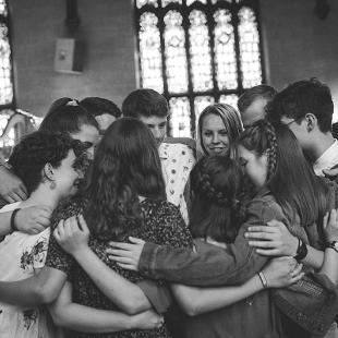 A small group of students in a huddle