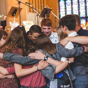 A group of students in prayer