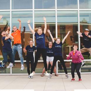 A group of Awakening students jumping in the air