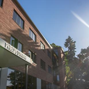 Close up of the Phelps Dining lettering on the Exterior of Phelps Hall from 10th Street.