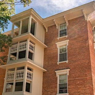 Exterior back staircase of Van Vleck Residence Hall from the Pine Grove