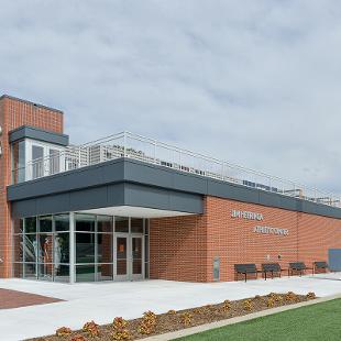 Full view of the Jim Herringa Athletic Center taken from west sideshowcasing the front and the entry way.