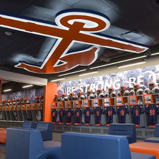 The locker room has 125 lockers and has dividers so it can be used for football in the fall and for the baseball and softball teams in the spring. There is a huge anchor mounted to the ceiling.