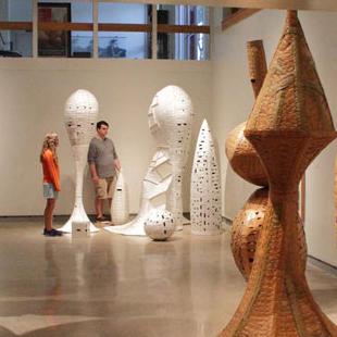 Two students working in a sculpture studio