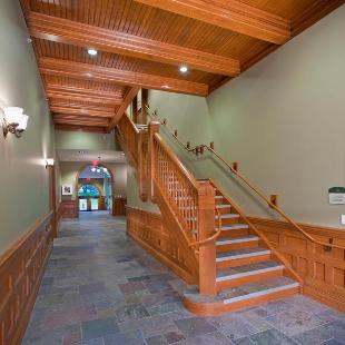 A restored hallway and staircase inside Graves Hall