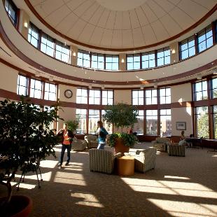 Students mingle in the rotunda of the Martha Miller Center