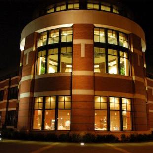 The Martha Miller Center is brightly lit at night